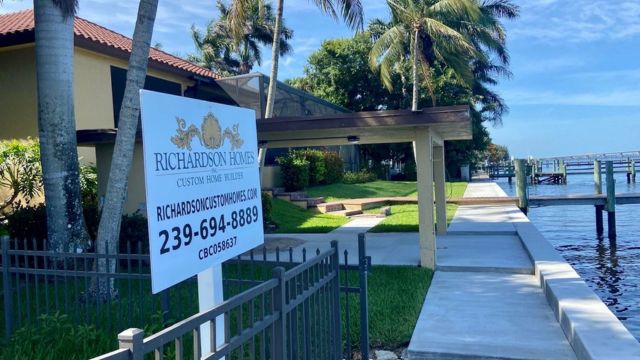 New Home on water with company sign-7 Must Have Features For SW Florida Homeowners-Richardson Homes-Fort Myers-640x360jpg